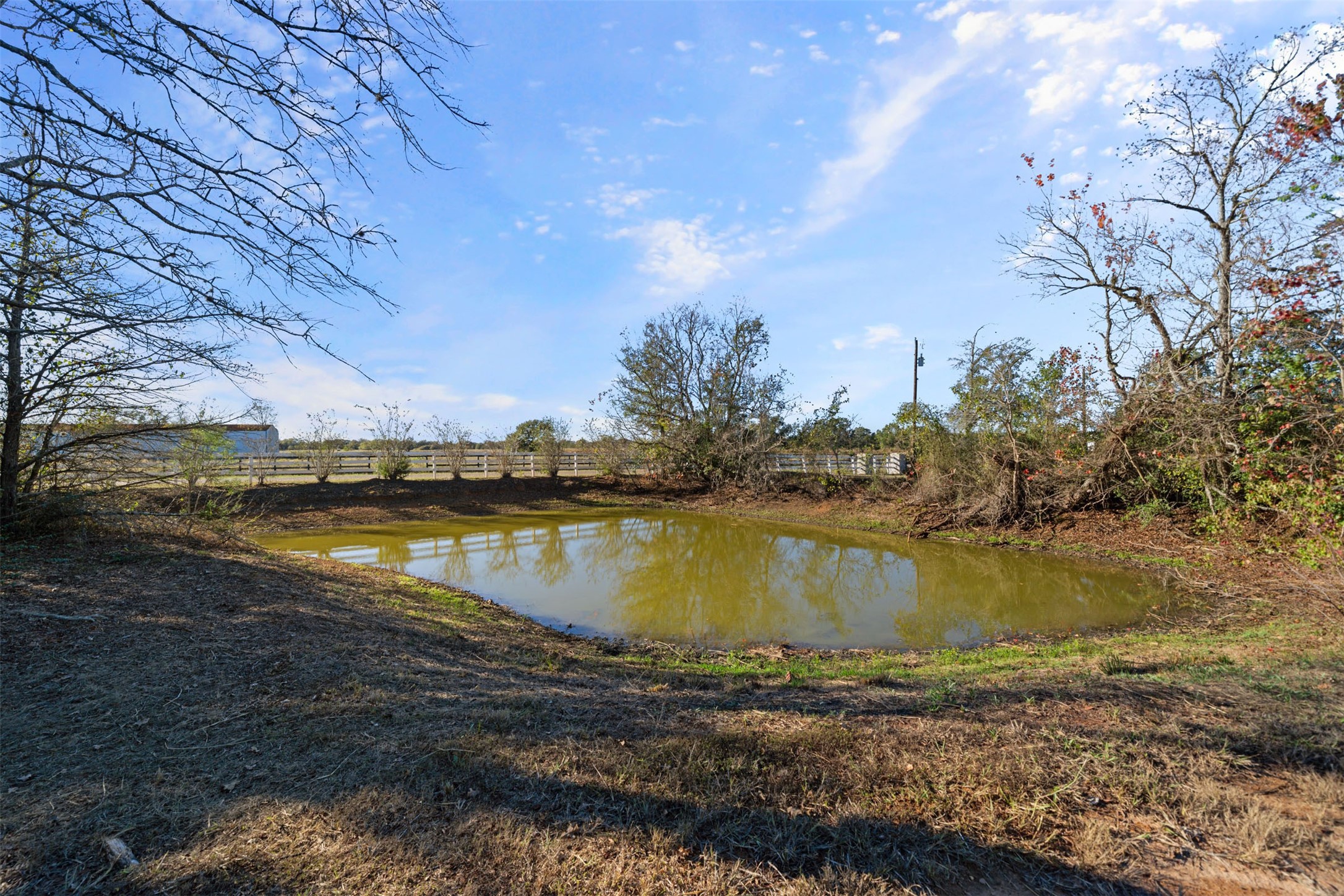 25948 Nelson Road Hempstead, TX 77445 - Photo 49 of 50 a view of a lake with a yard