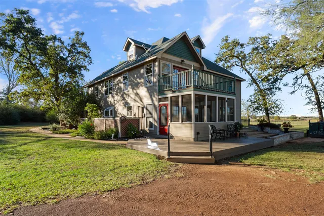 a view of a house with a yard porch and sitting area
