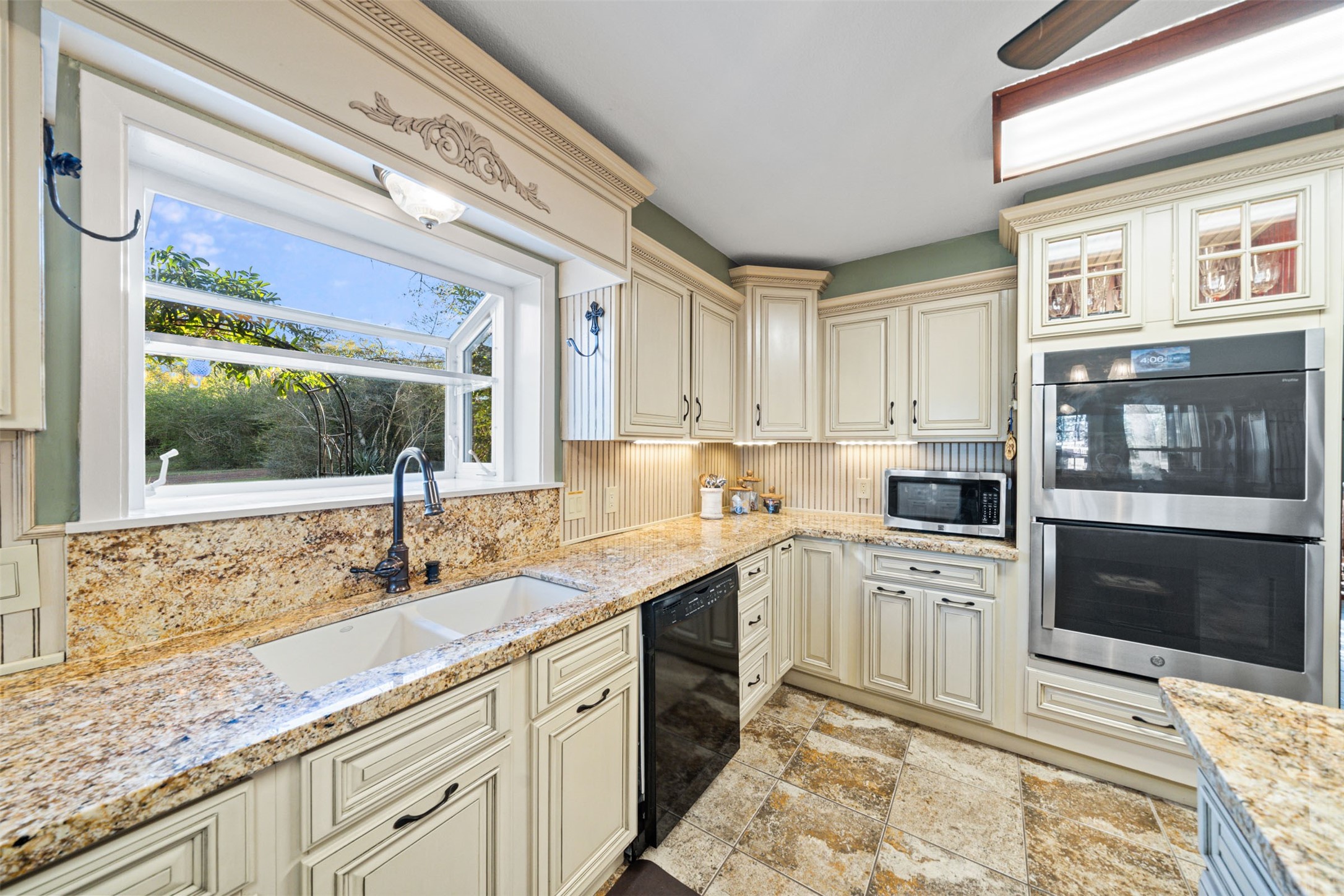 25948 Nelson Road Hempstead, TX 77445 - Photo 7 of 50 a kitchen with a sink stove and cabinets