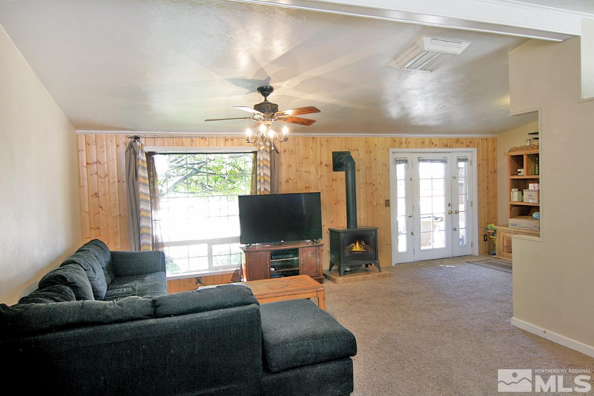 17230 Touraco Street Reno, NV 89508 - Photo 3 of 21 a living room with furniture and a flat screen tv