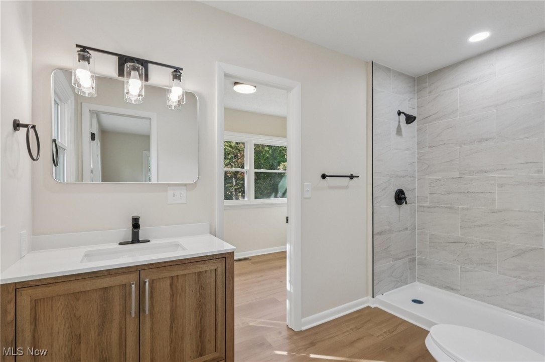 50963 Becker Road Oberlin, OH 44074 - Photo 27 of 37 Full bath with light wood-type flooring, vanity, a stall shower, and recessed lighting