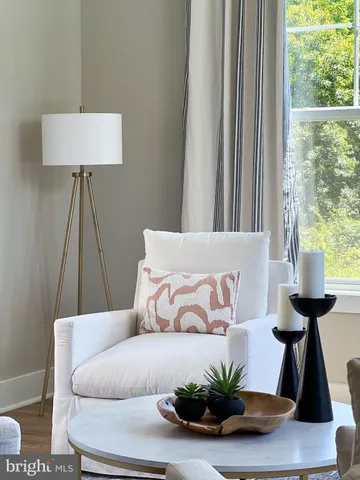 a bedroom with a large bed and a potted plant