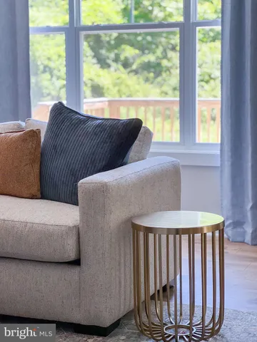 a en suite bathroom with a granite countertop sink and a mirror