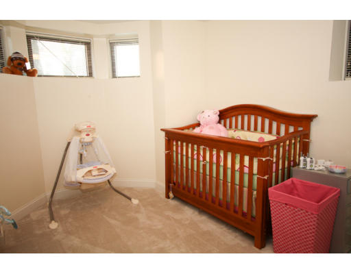 10 Beacon Street, Unit 1 Chelsea, MA 02150 - Photo 13 of 17 a bedroom with a bed and wooden floor