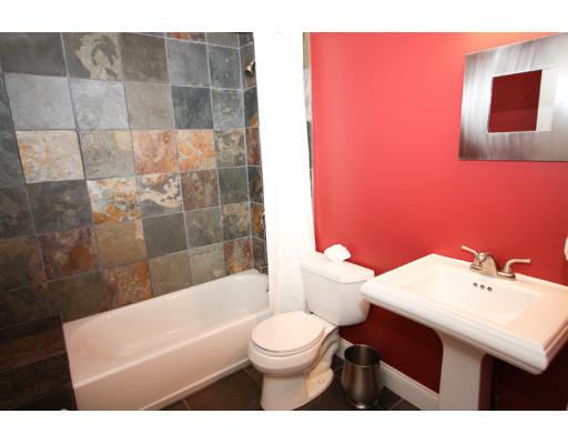 10 Beacon Street, Unit 1 Chelsea, MA 02150 - Photo 5 of 17 a bathroom with a sink a toilet and shower