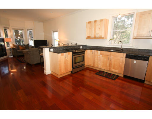 10 Beacon Street, Unit 1 Chelsea, MA 02150 - Photo 7 of 17 a kitchen with granite countertop a stove and a sink
