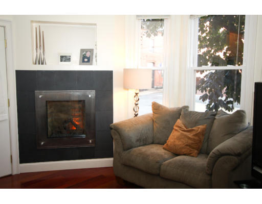 10 Beacon Street, Unit 1 Chelsea, MA 02150 - Photo 10 of 17 a living room with furniture a window and a fireplace