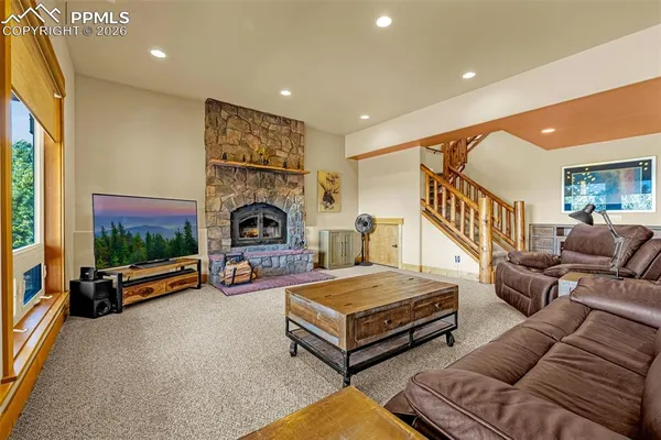 a bedroom with furniture and a flat screen tv