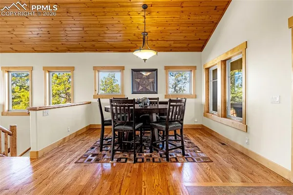 a view of a dining room with furniture window and wooden floor