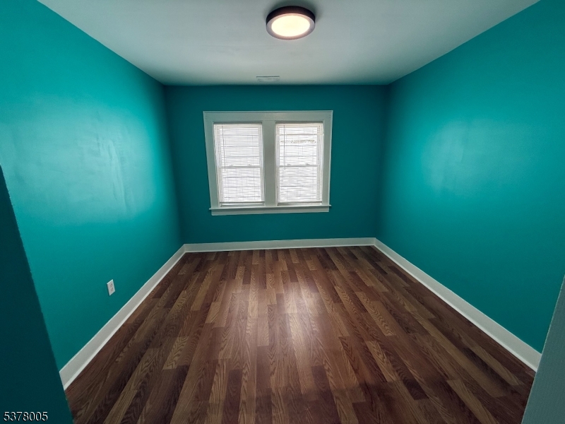 588 Chestnut Street, Unit 2 Orange, NJ 07050 - Photo 14 of 16 a view of room with window and hardwood