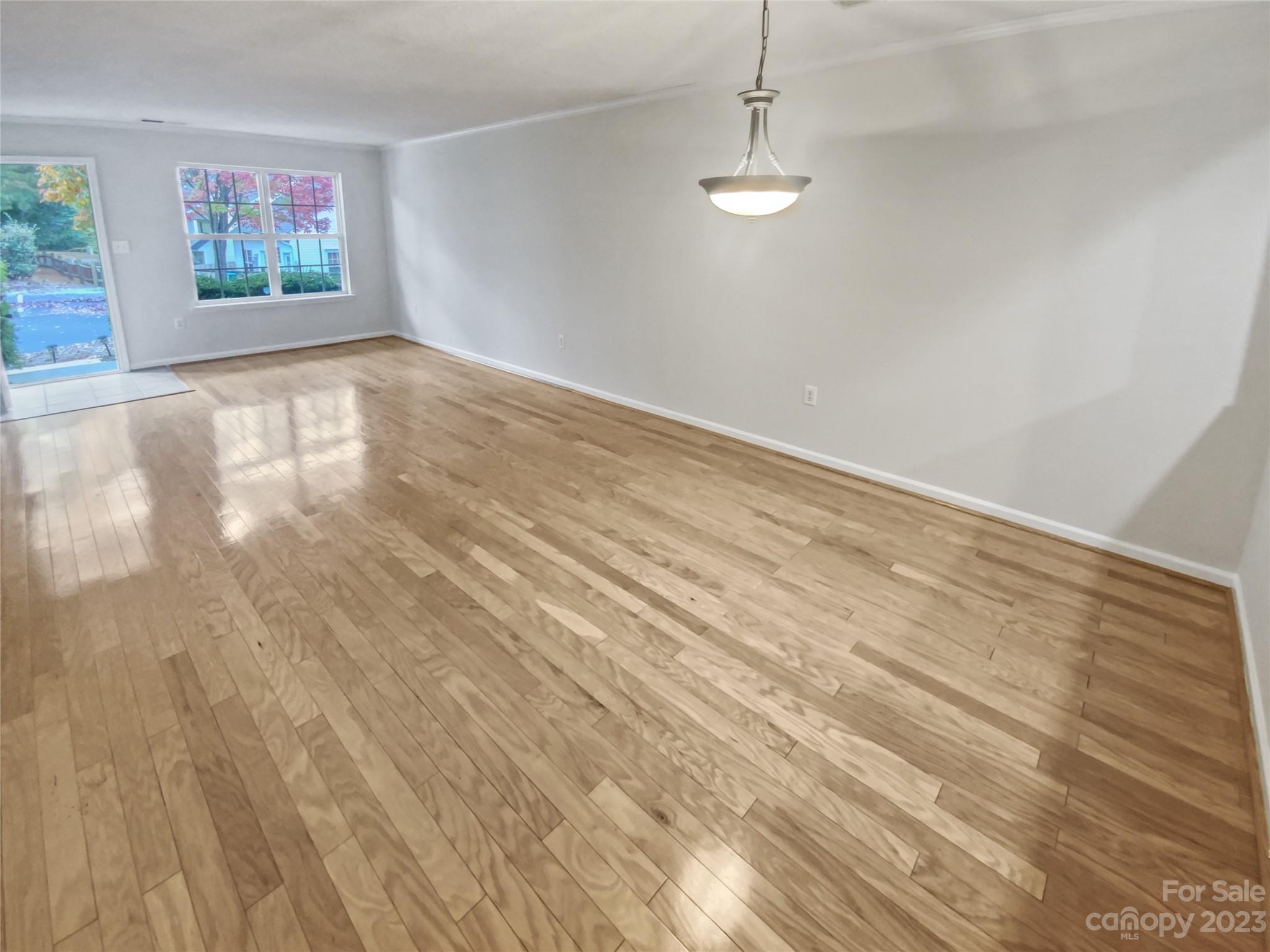 414 Robin Reed Court Pineville, NC 28134 - Photo 11 of 27 a view of a room with wooden floor and window