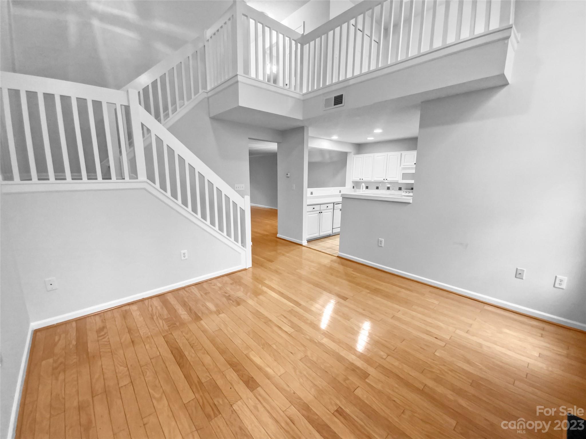 414 Robin Reed Court Pineville, NC 28134 - Photo 12 of 27 a view of an entryway with wooden floor