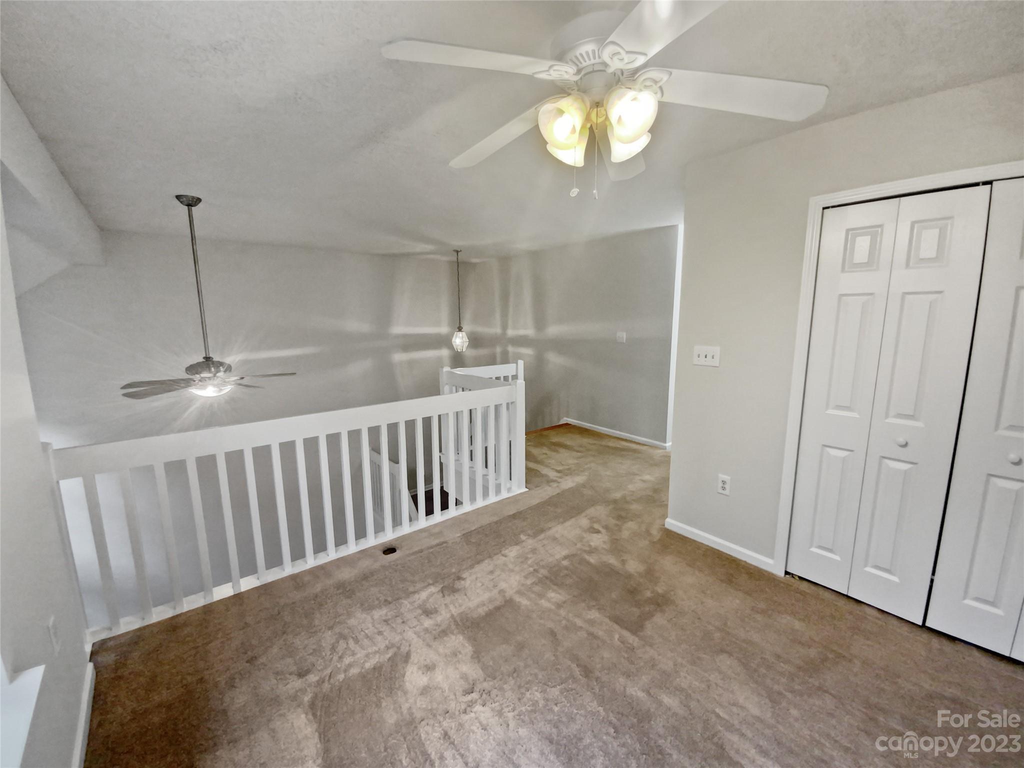 414 Robin Reed Court Pineville, NC 28134 - Photo 17 of 27 a view of a hallway to rooms and stairs
