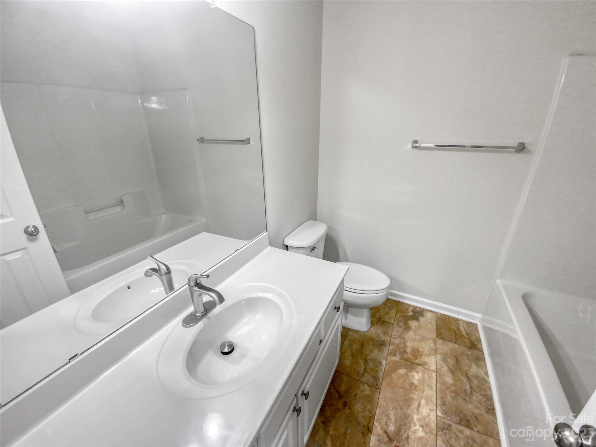 414 Robin Reed Court Pineville, NC 28134 - Photo 18 of 27 a bathroom with a sink and a mirror