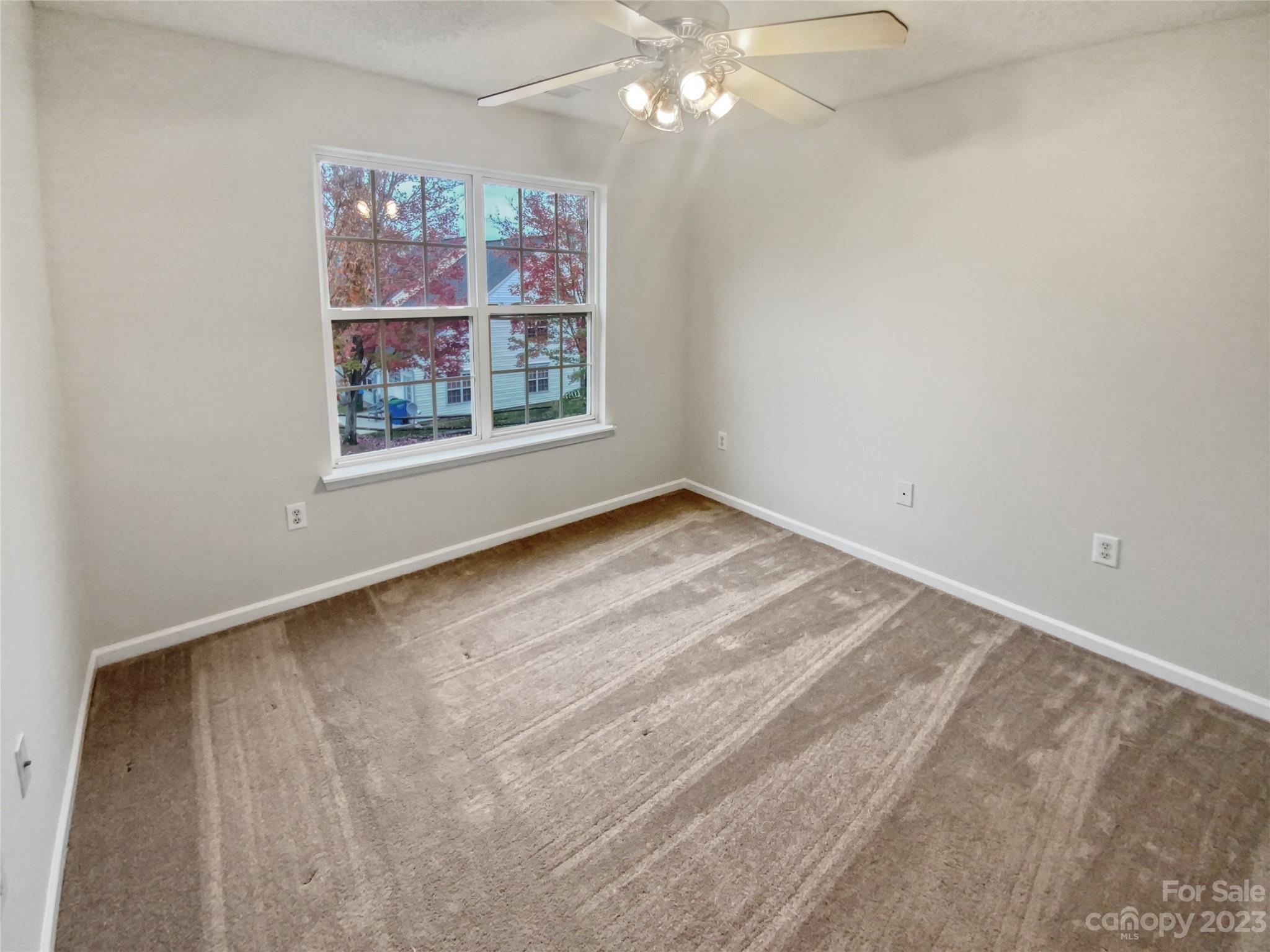 414 Robin Reed Court Pineville, NC 28134 - Photo 5 of 27 a view of a livingroom with an empty space and a window