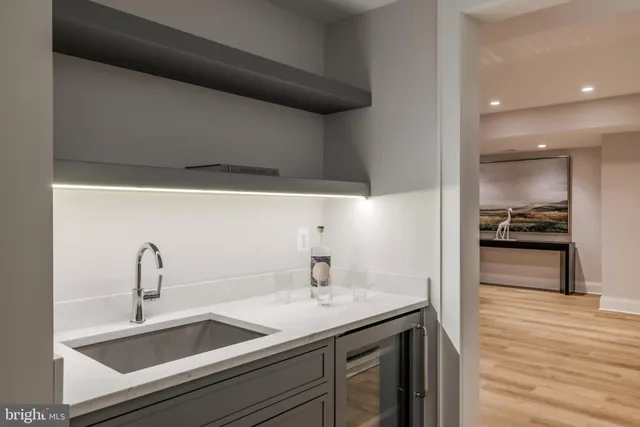 a kitchen with a sink and a refrigerator