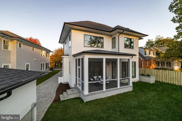 a view of a house with a yard and deck