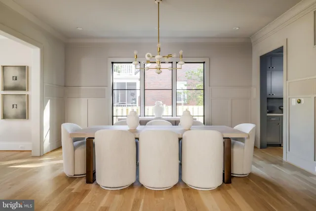 a dining room with furniture and wooden floor
