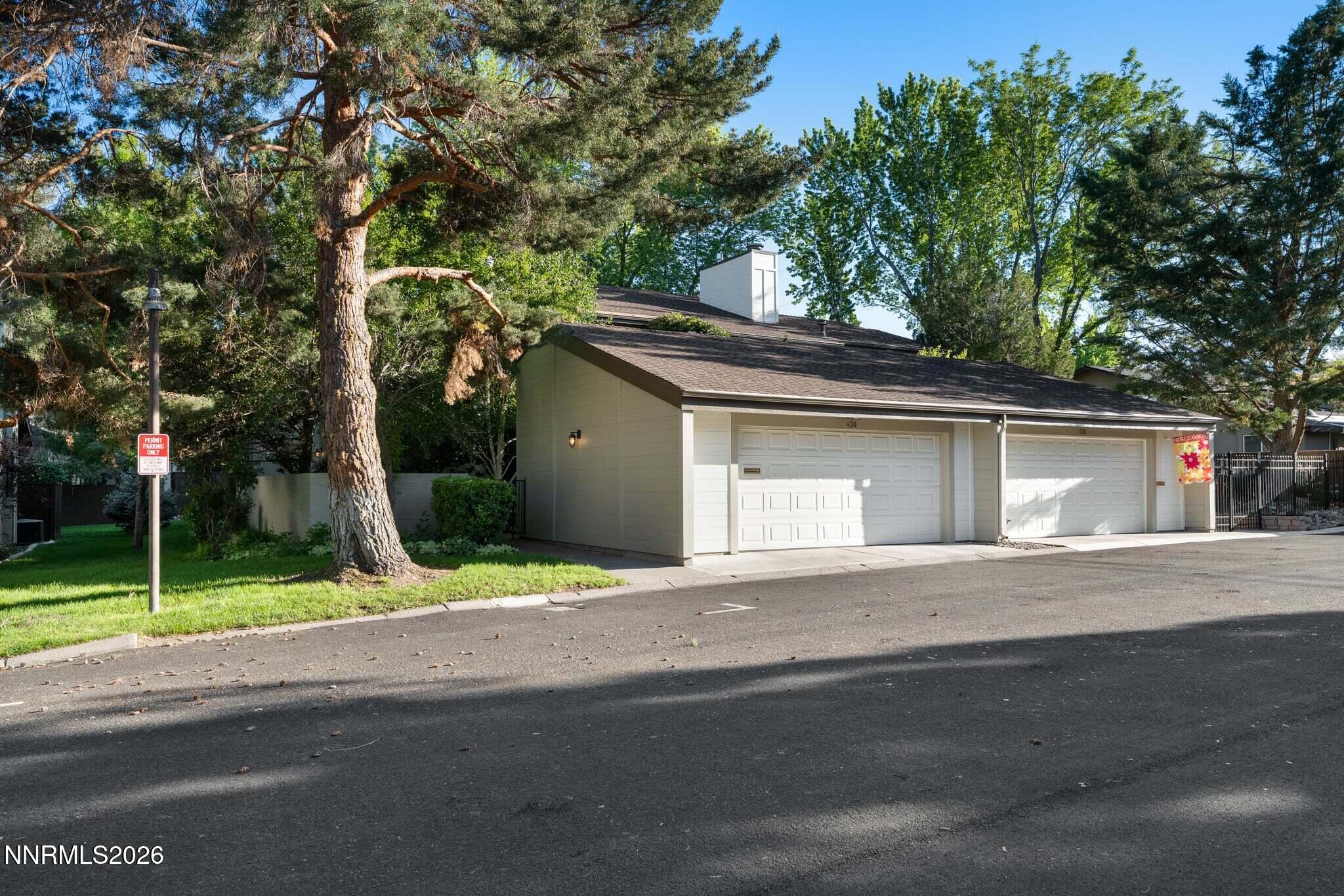 430 Angela Place Reno, NV 89509 - Photo 3 of 48 a yellow house with trees in front of it