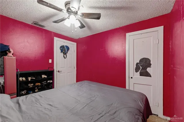 a bed room with a bed and a mirror