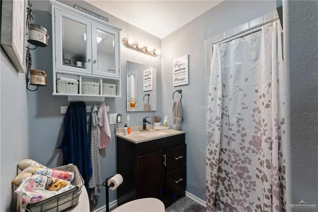 a bathroom with a sink a vanity and a mirror