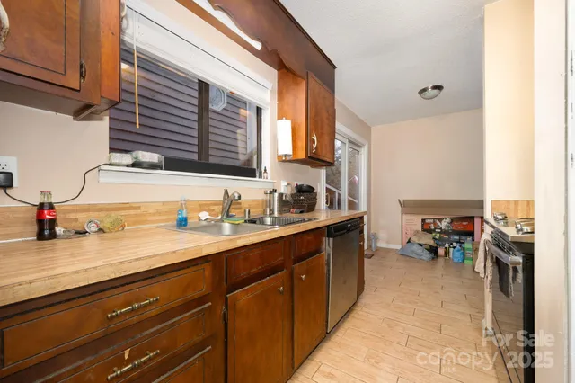 a kitchen with sink cabinets and stove