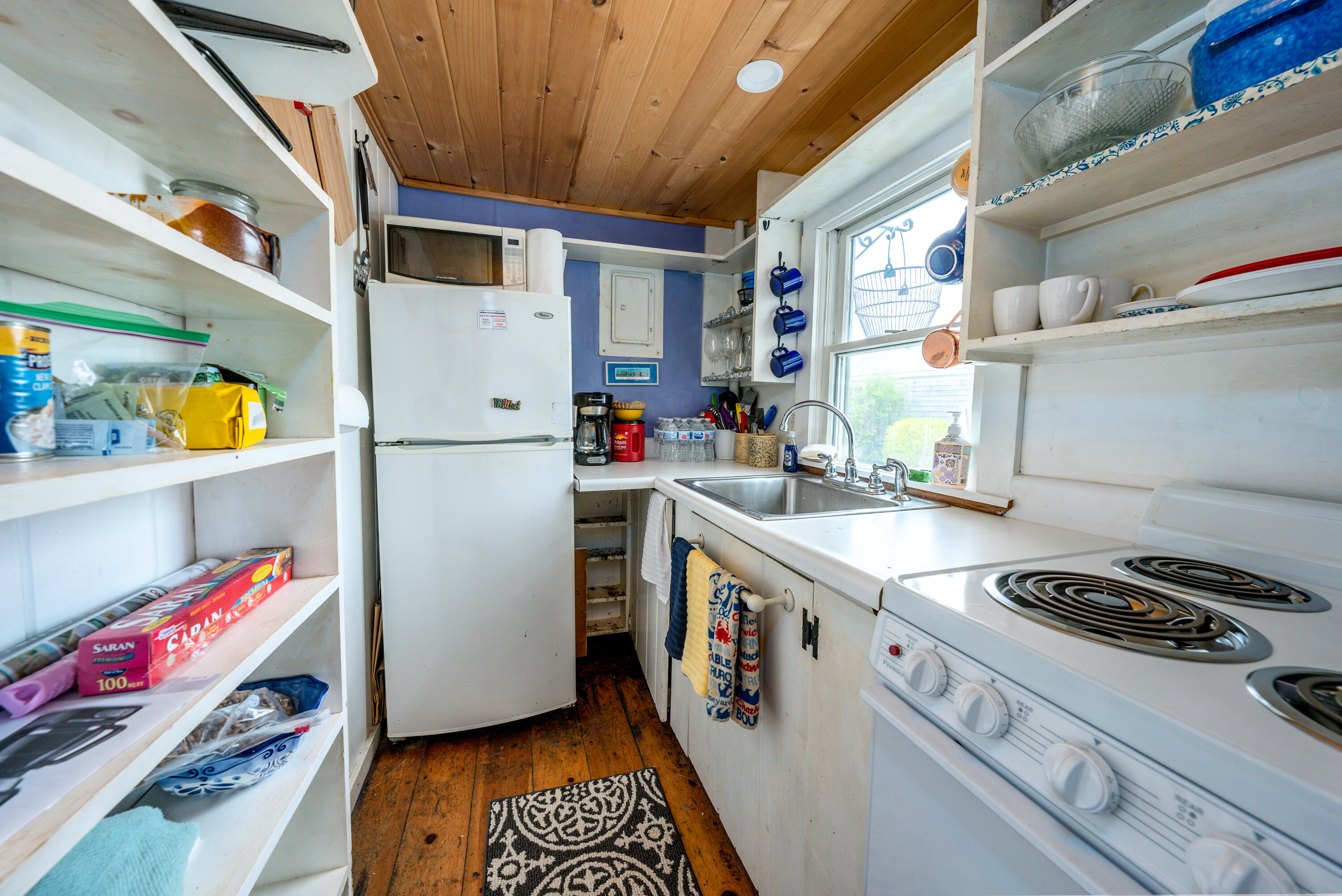 575 Chequessett Neck Road, Unit KSCALLLOP Wellfleet, MA 02667 - Photo 12 of 17 a kitchen with a refrigerator and a stove top oven
