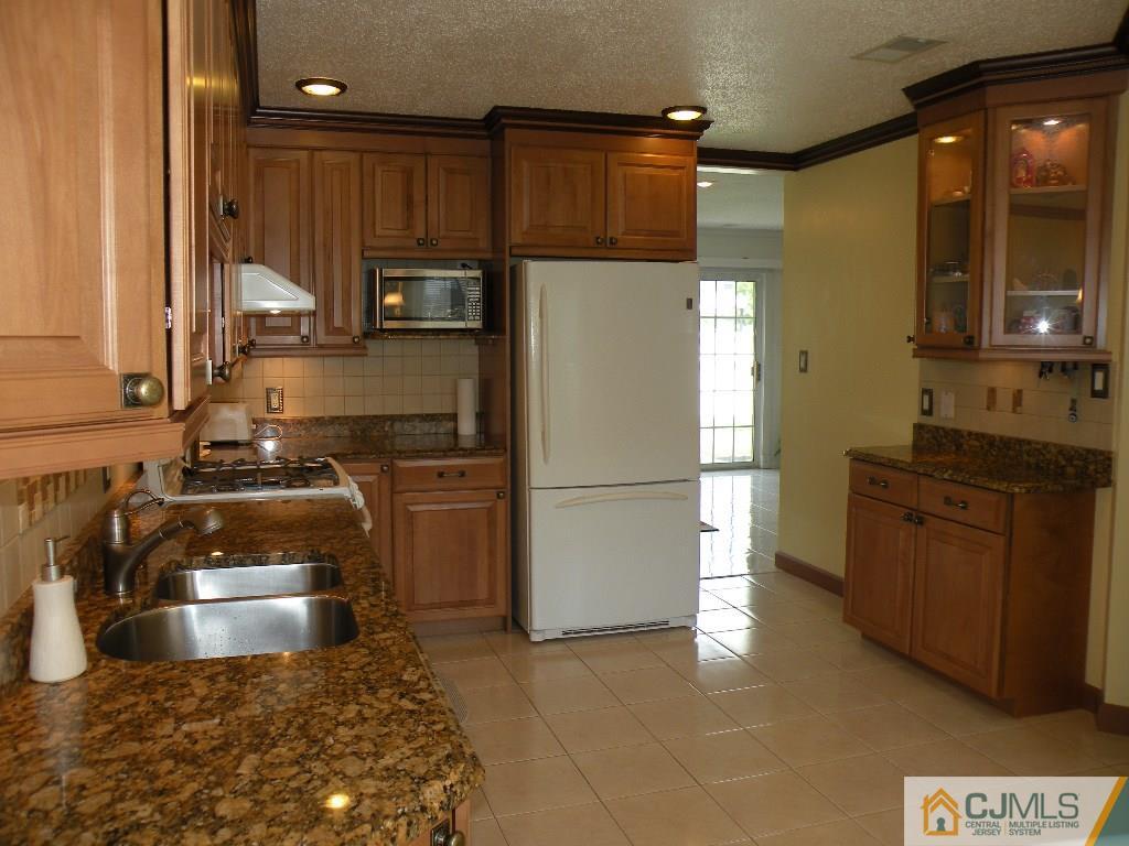 108 Orion Road Piscataway, NJ 08854 - Photo 1 of 16 a kitchen with a refrigerator sink and stove