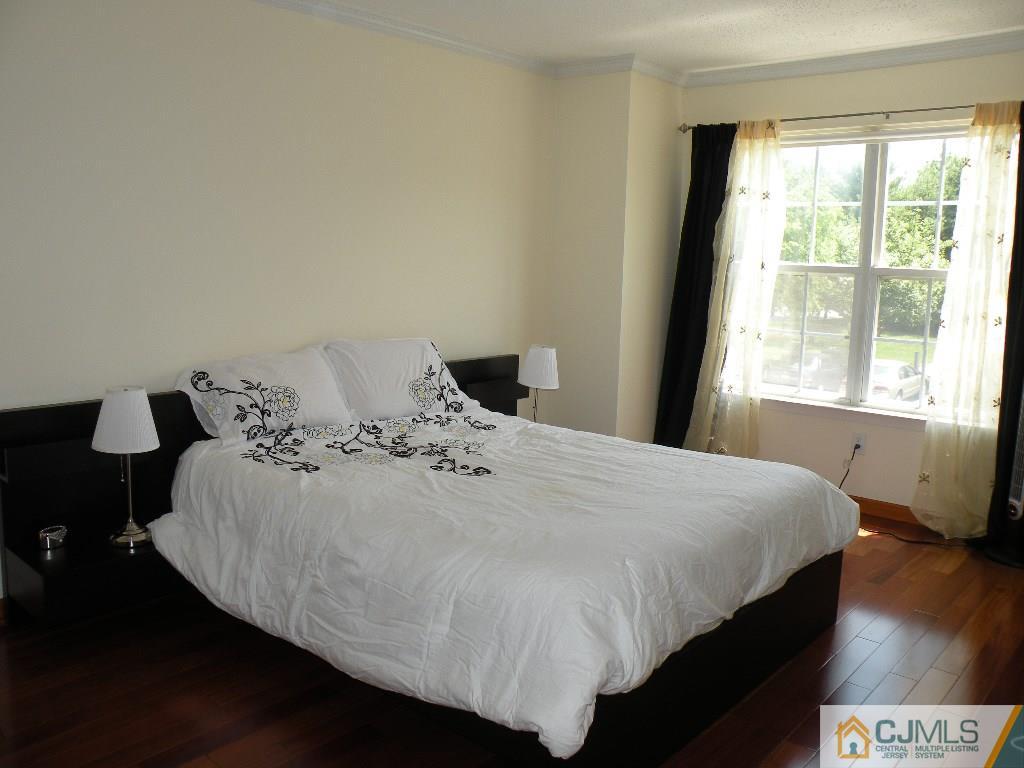 108 Orion Road Piscataway, NJ 08854 - Photo 12 of 16 a bedroom with a bed and wooden floor