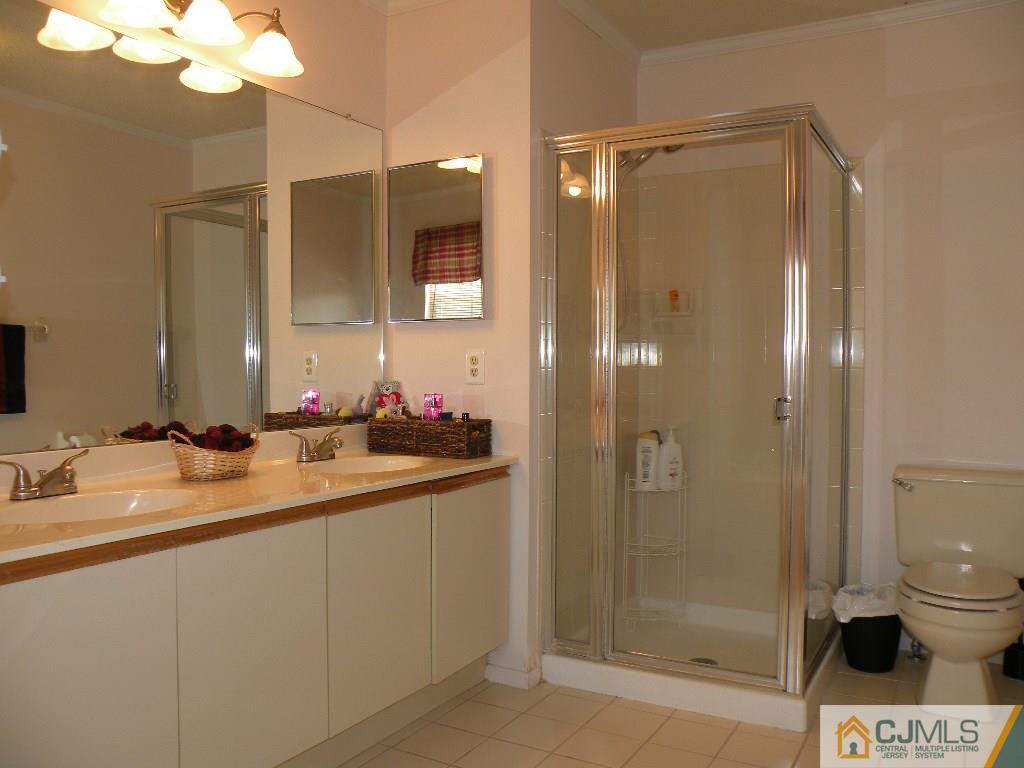 108 Orion Road Piscataway, NJ 08854 - Photo 13 of 16 a bathroom with a shower sink vanity and toilet