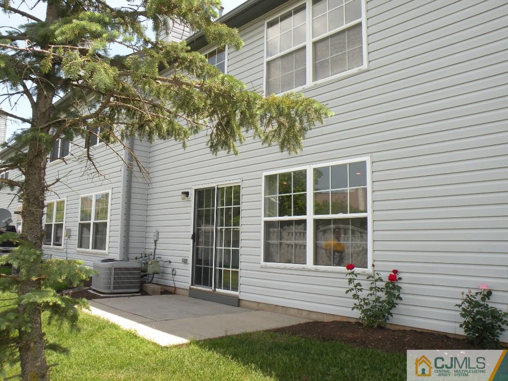 108 Orion Road Piscataway, NJ 08854 - Photo 15 of 16 a front view of a house with a garden