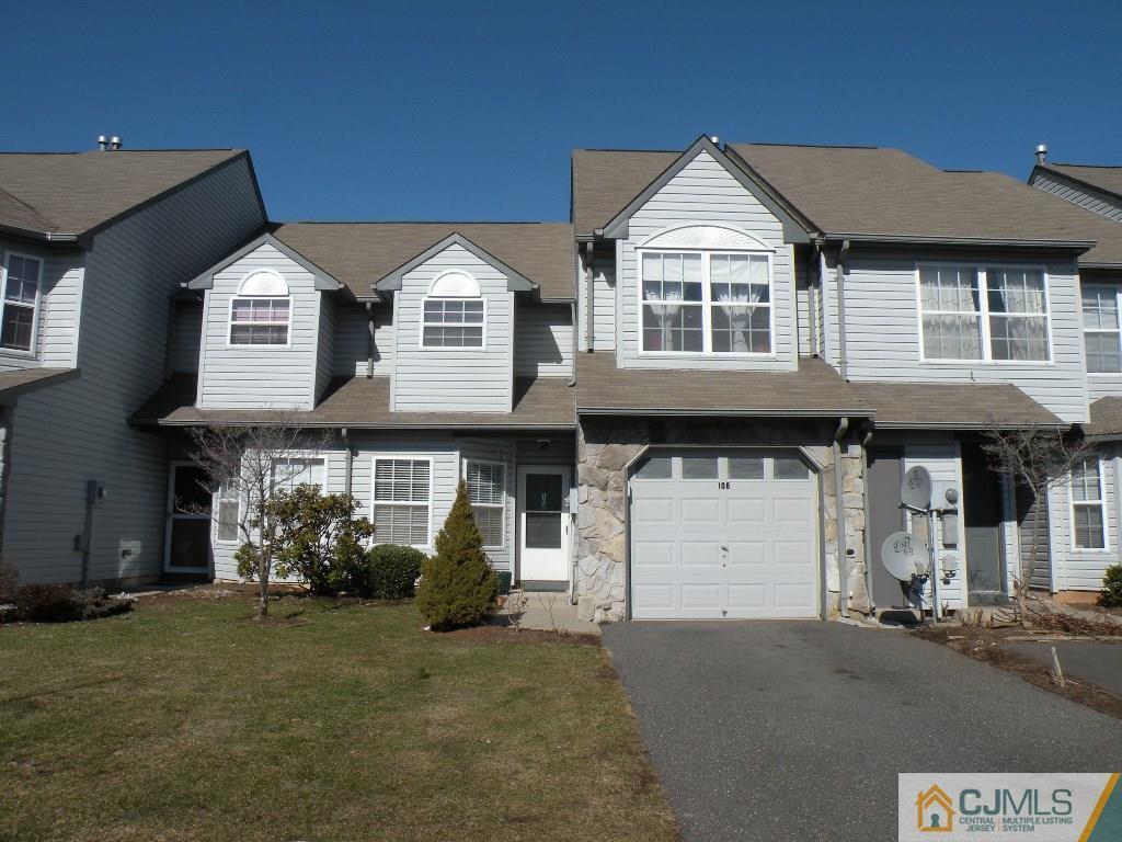108 Orion Road Piscataway, NJ 08854 - Photo 16 of 16 a front view of a house with a yard and garage