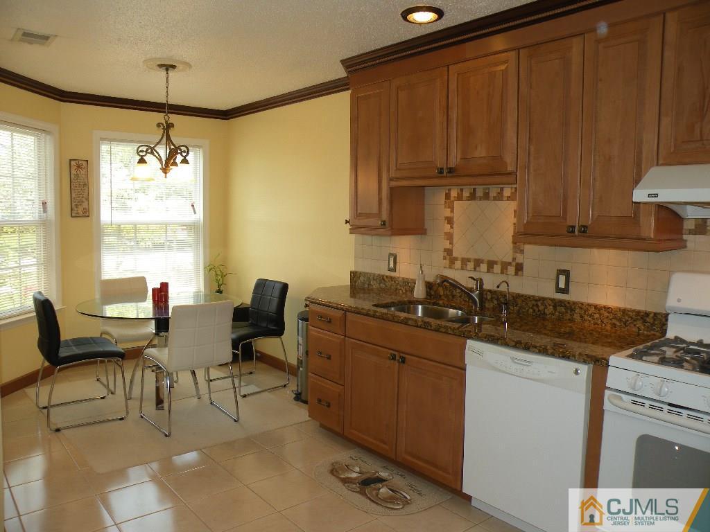 108 Orion Road Piscataway, NJ 08854 - Photo 3 of 16 a kitchen with a sink and cabinets