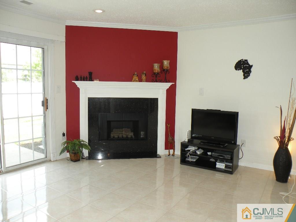 108 Orion Road Piscataway, NJ 08854 - Photo 6 of 16 a living room with furniture and a fireplace