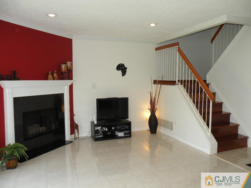 108 Orion Road Piscataway, NJ 08854 - Photo 8 of 16 a living room with furniture and a fireplace