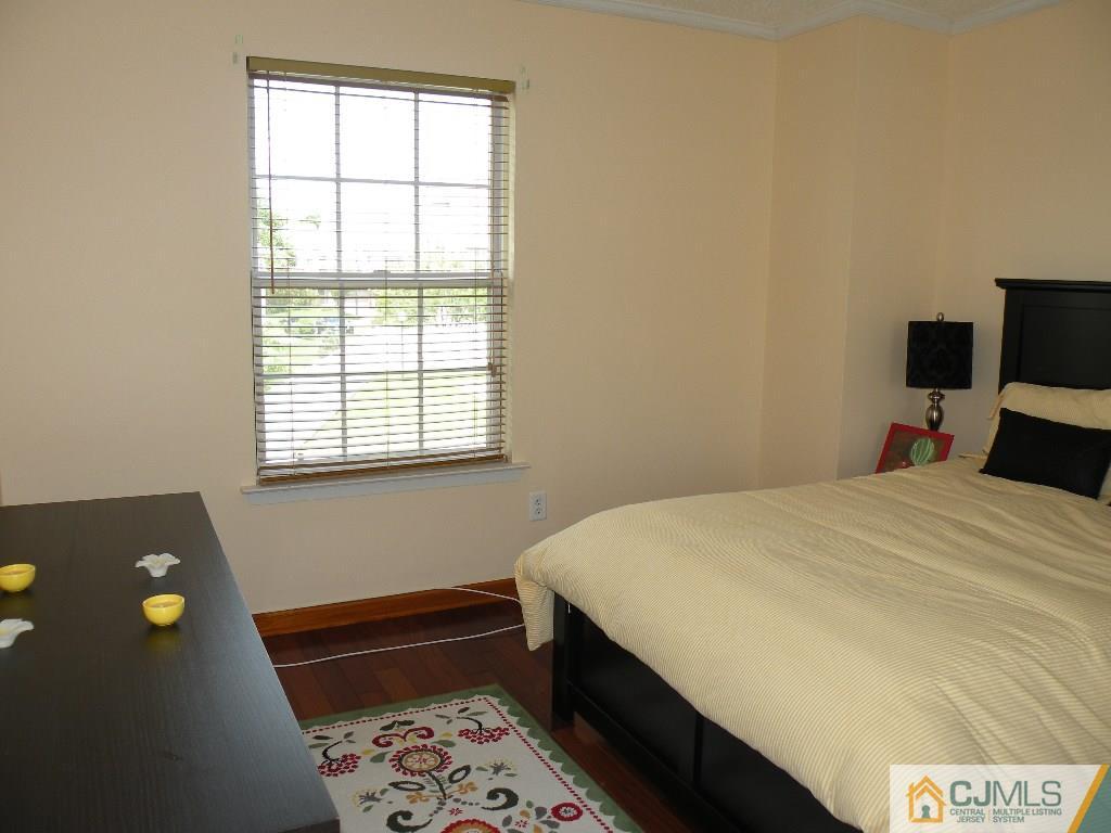 108 Orion Road Piscataway, NJ 08854 - Photo 9 of 16 a bedroom with a bed and a window