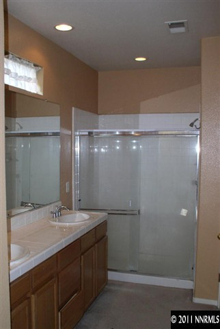 9752 Ripple Way Reno, NV 89521 - Photo 11 of 13 a bathroom with a sink shower and a mirror