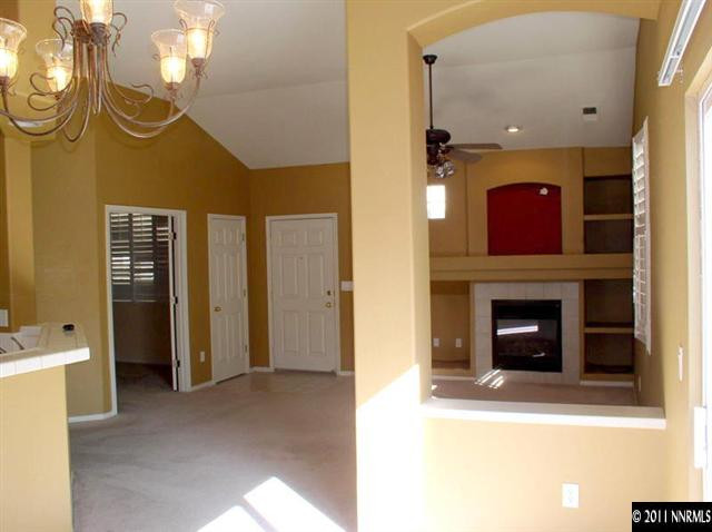 9752 Ripple Way Reno, NV 89521 - Photo 5 of 13 a view of a livingroom with a fireplace and window