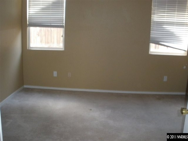 9752 Ripple Way Reno, NV 89521 - Photo 10 of 13 an empty room with a window