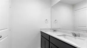 a view of a backyard with wooden fence