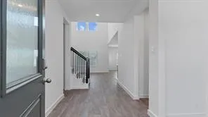 a view of a hallway with staircase