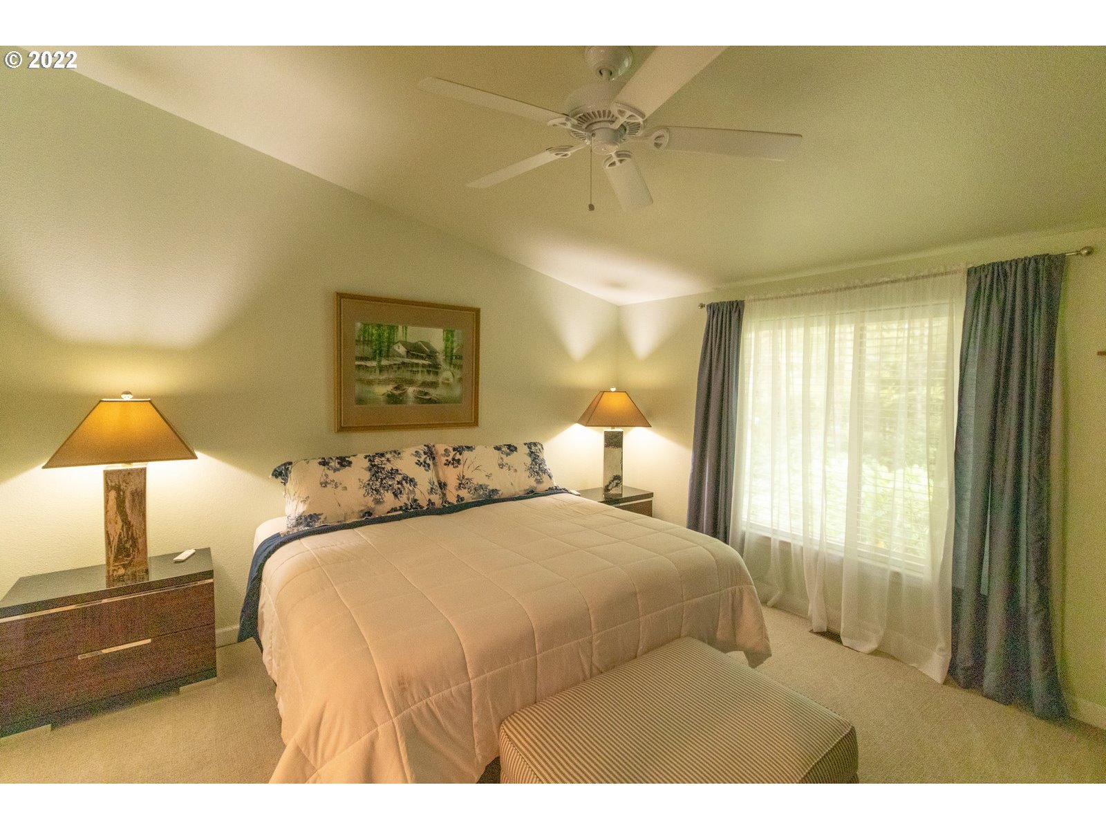 5732 Nicholson Road Florence, OR 97439 - Photo 16 of 31 a bedroom with a bed and a lamp