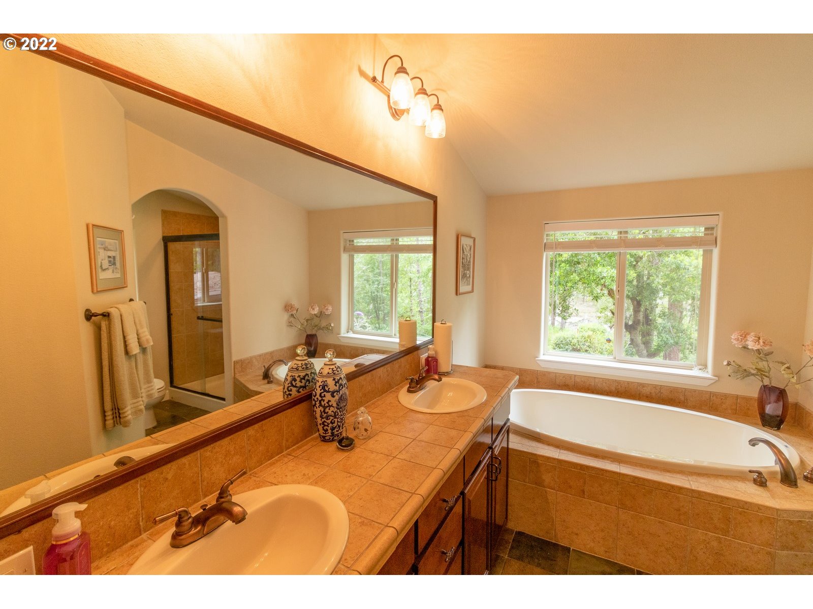 5732 Nicholson Road Florence, OR 97439 - Photo 17 of 31 a bathroom with a bathtub and a sink