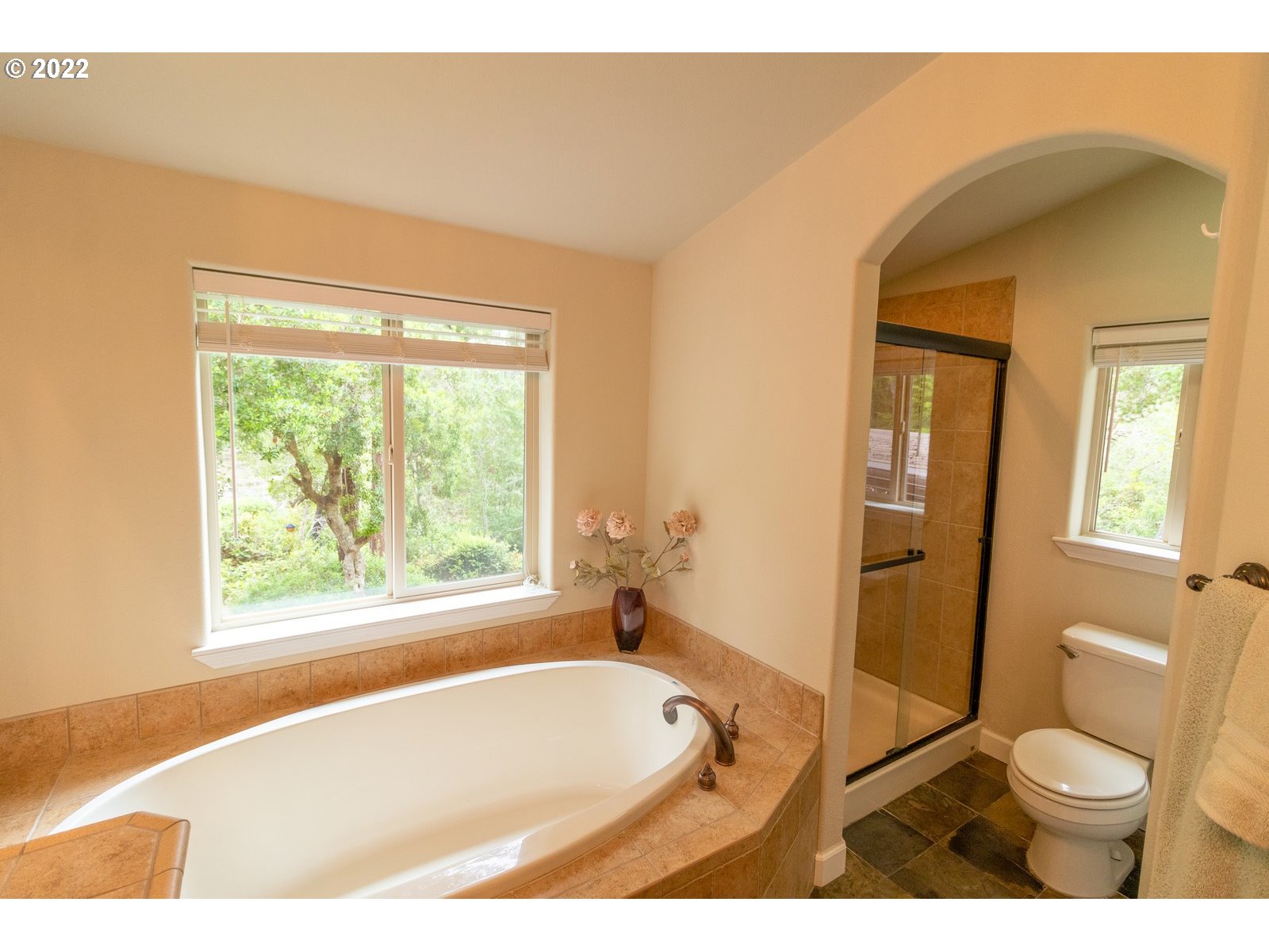 5732 Nicholson Road Florence, OR 97439 - Photo 18 of 31 a bathroom with a granite countertop sink toilet and shower