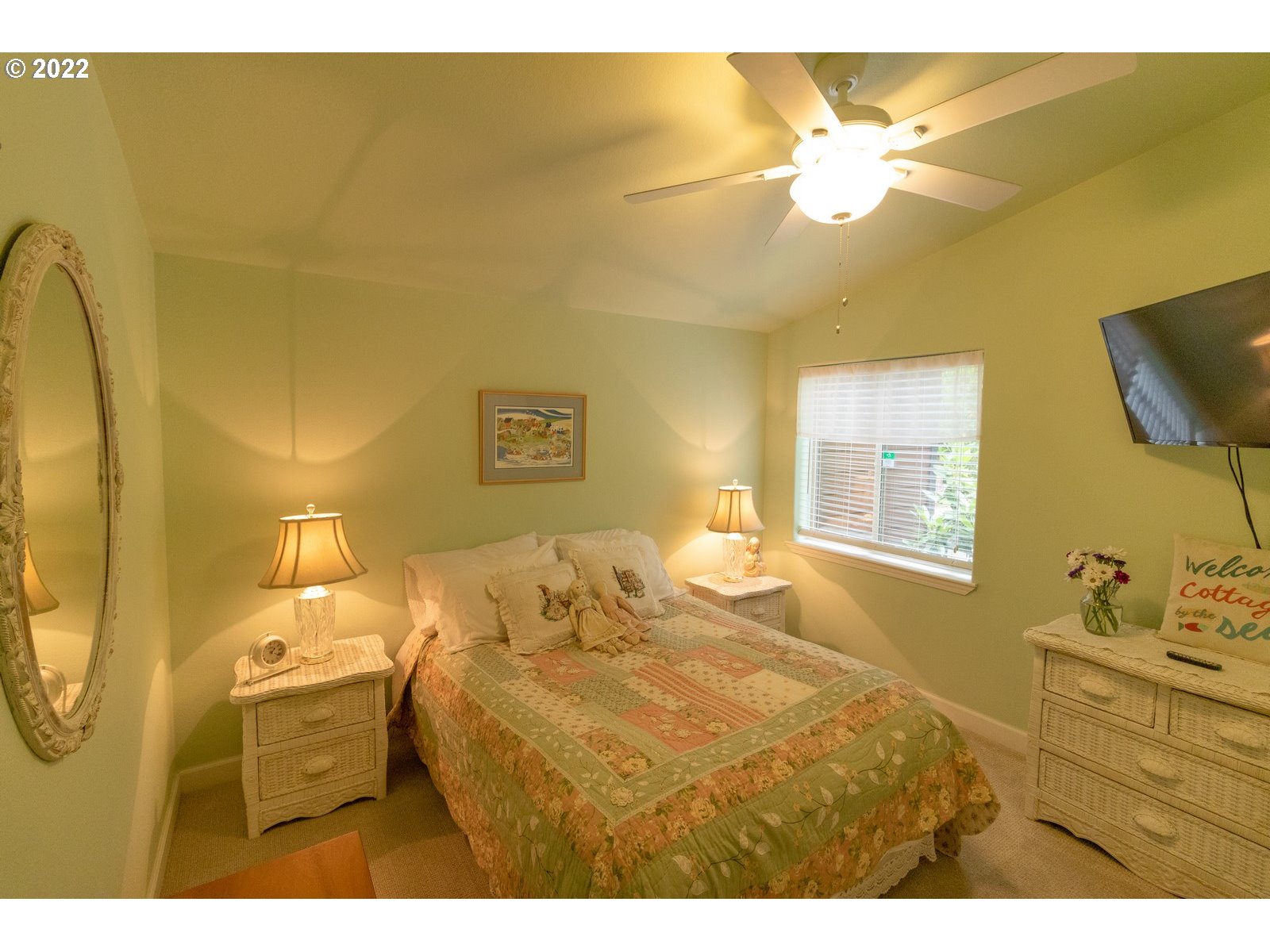 5732 Nicholson Road Florence, OR 97439 - Photo 19 of 31 a bedroom with a bed and a chandelier