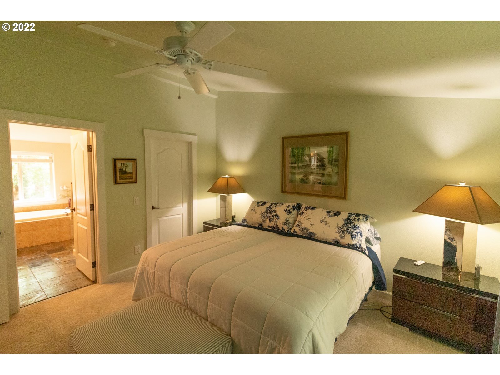 5732 Nicholson Road Florence, OR 97439 - Photo 20 of 31 a bedroom with a bed and a lamp