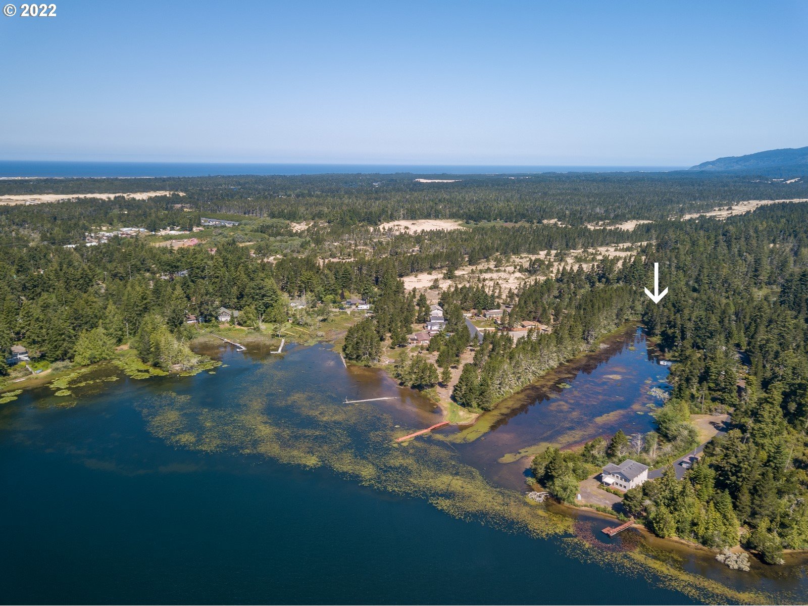 5732 Nicholson Road Florence, OR 97439 - Photo 2 of 31 an aerial view of ocean and residential houses with outdoor space
