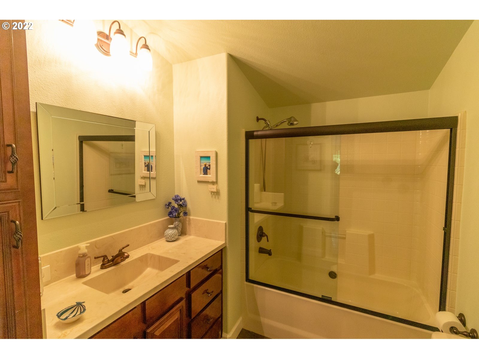 5732 Nicholson Road Florence, OR 97439 - Photo 21 of 31 a bathroom with a sink mirror and shower