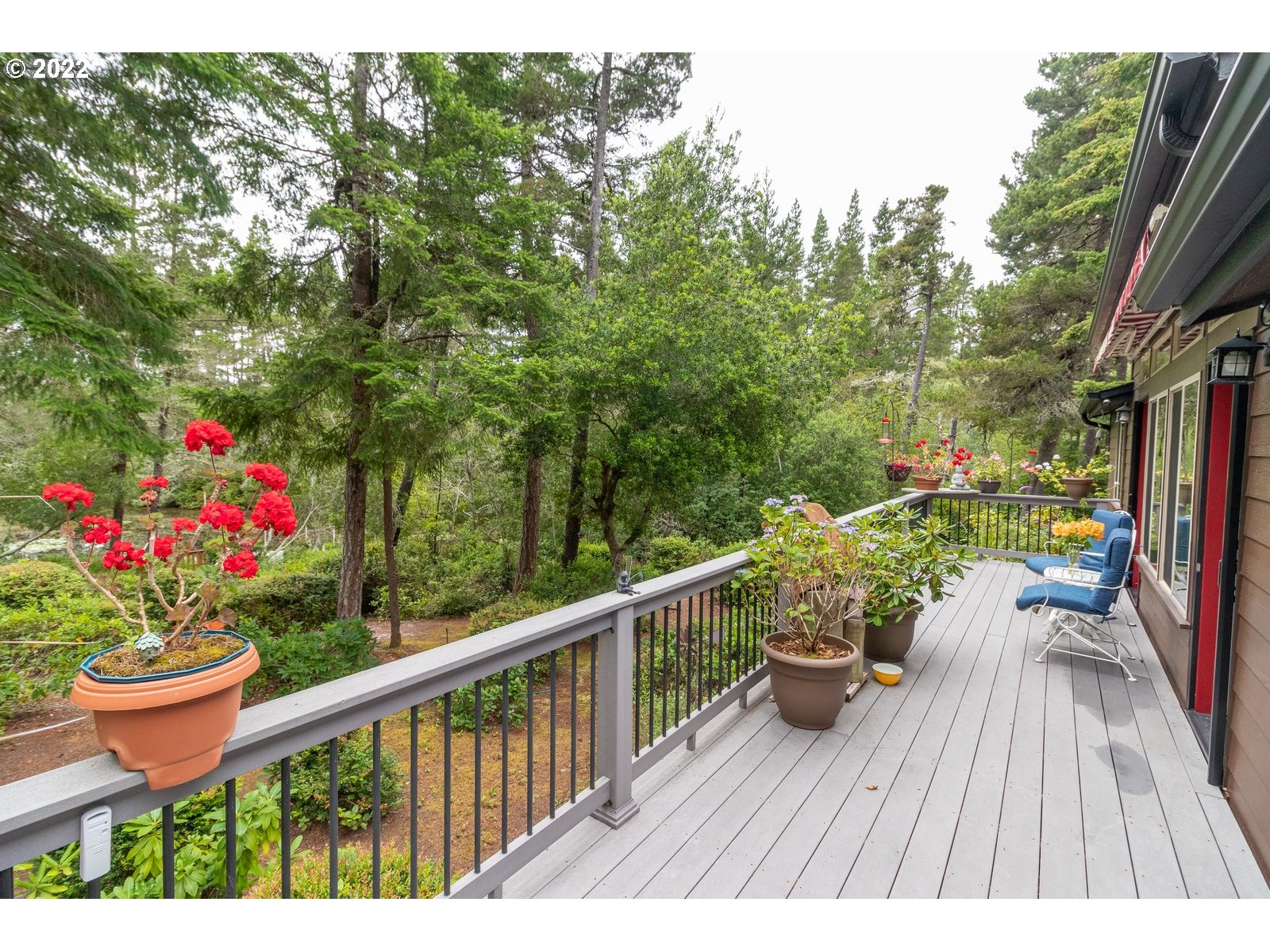5732 Nicholson Road Florence, OR 97439 - Photo 23 of 31 a view of a balcony with wooden floor and outdoor seating