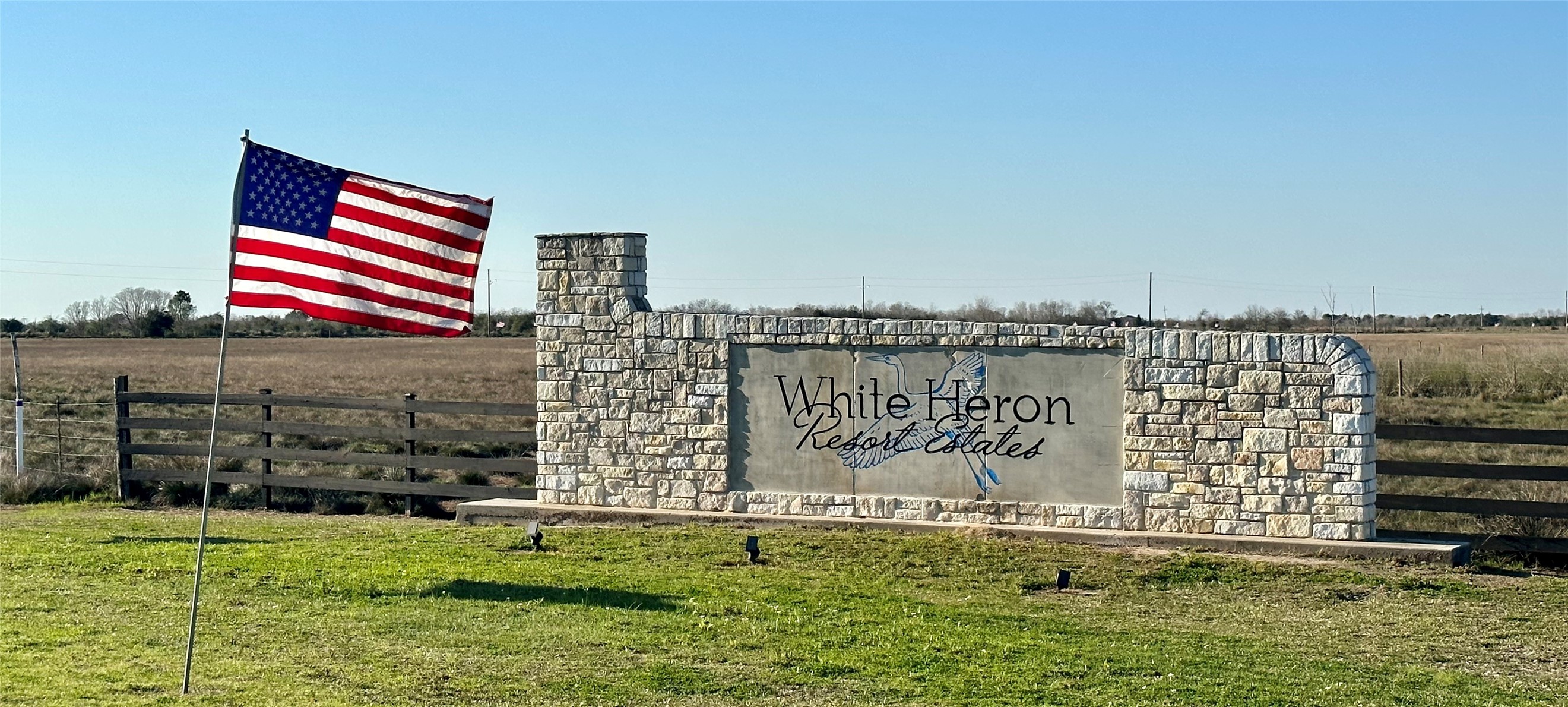 7-8 Cardinal Lane Anahuac, TX 77514 - Photo 9 of 9 a front view of a building with a yard